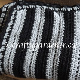 a black and grey stripe afghan at craftygardener.ca