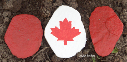 Canadian flag made of 3 flat rocks