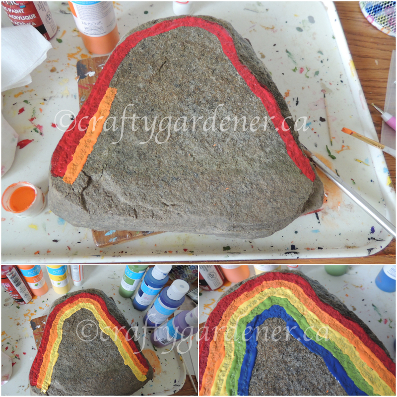 painting a rainbow rock at craftygardener.ca