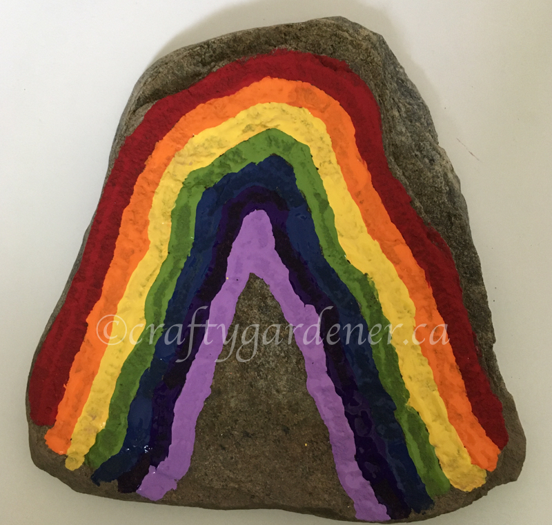 painting a rainbow rock at craftygardener.ca