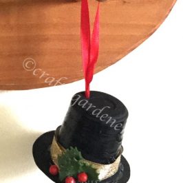 how to make a snowman hat out of a coffee pod container at craftygardener.ca